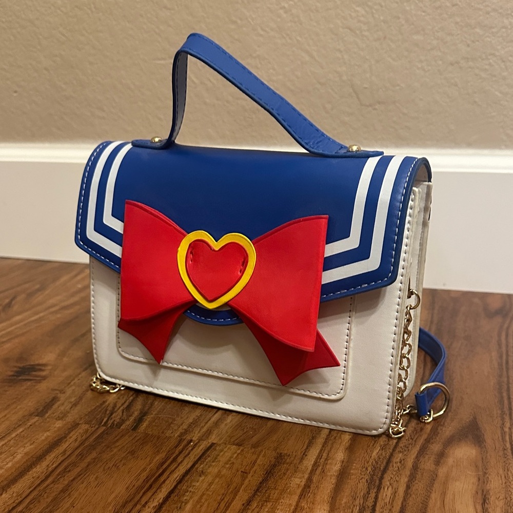 Chic Blue and White Shoulder Bag with Red Bow